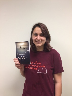 Editor Haley Poluchuk with this year's issue of Widener Ink